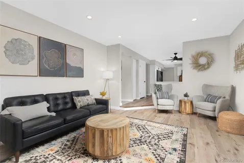 a living room with furniture and a rug