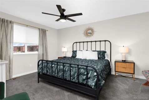 a bedroom with a bed and window