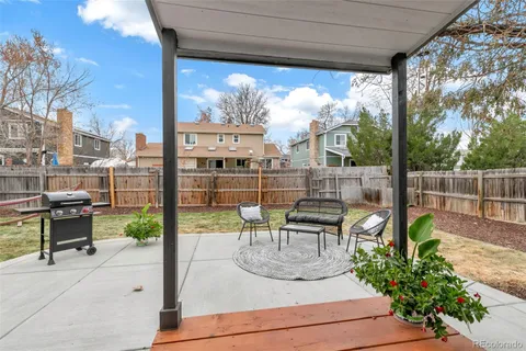 a view of a patio with couches table and chairs