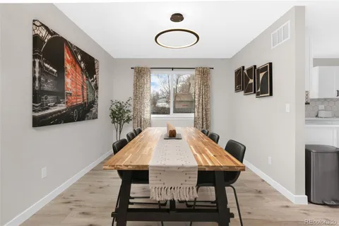 a view of a dining room with furniture and window