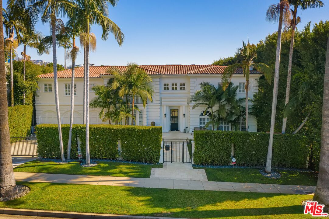 708 North Hillcrest Road Beverly Hills, CA 90210 - Photo 11 of 11 a view of a palm trees in front of a house