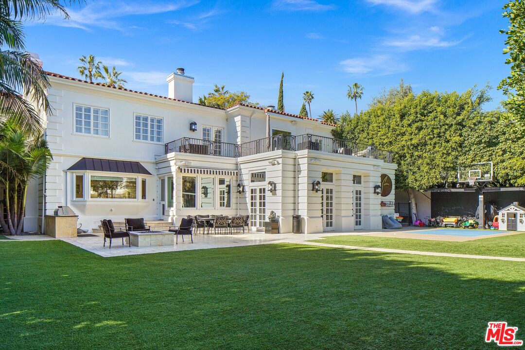 708 North Hillcrest Road Beverly Hills, CA 90210 - Photo 2 of 11 a front view of building with outdoor seating