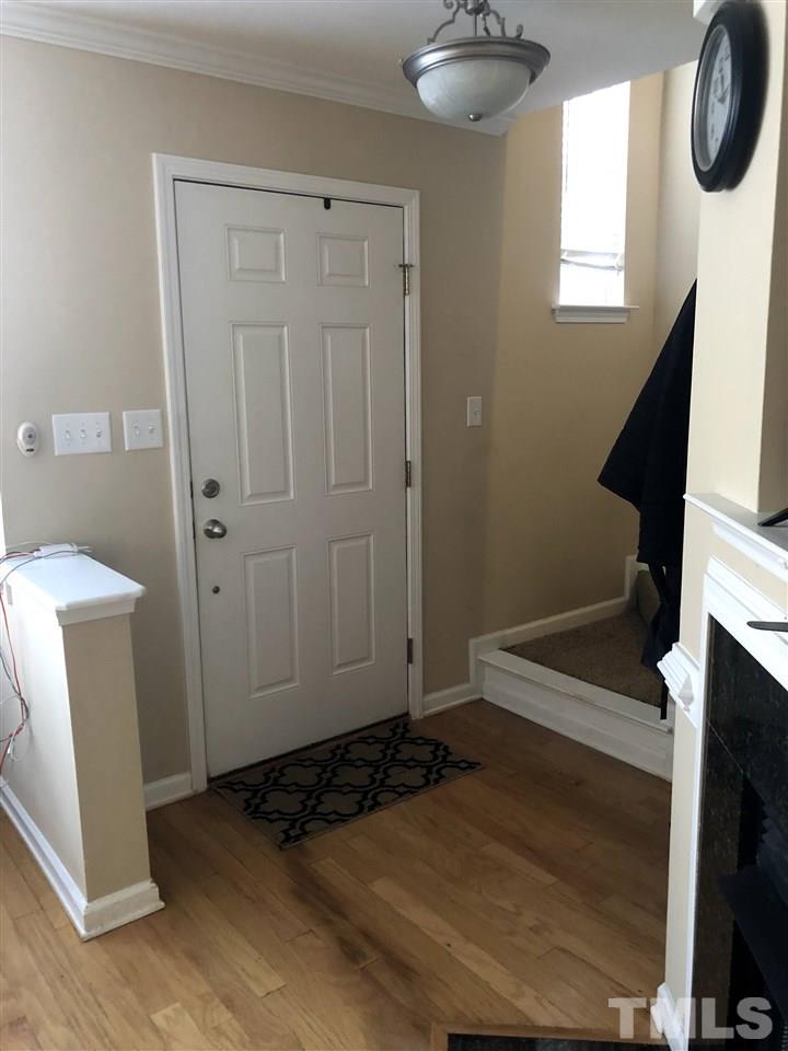 9910 Layla Avenue Raleigh, NC 27617 - Photo 2 of 13 a view of an entryway with wooden floor