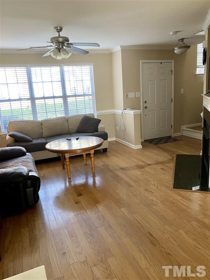 9910 Layla Avenue Raleigh, NC 27617 - Photo 4 of 13 a living room with furniture and a large window