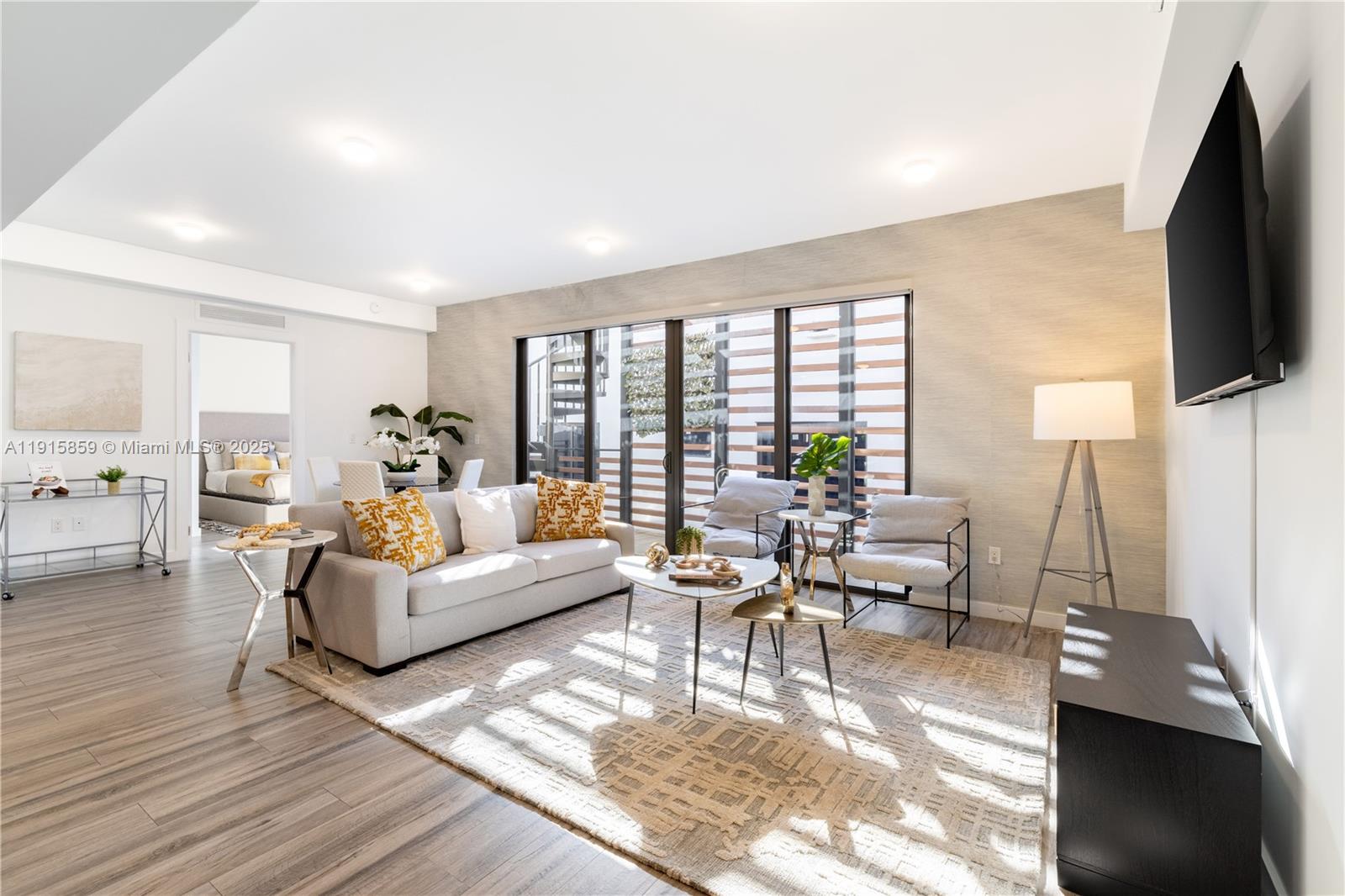 2955 Bird Avenue, Unit PHB Miami, FL 33133 - Photo 1 of 23 a living room with fireplace furniture and a flat screen tv