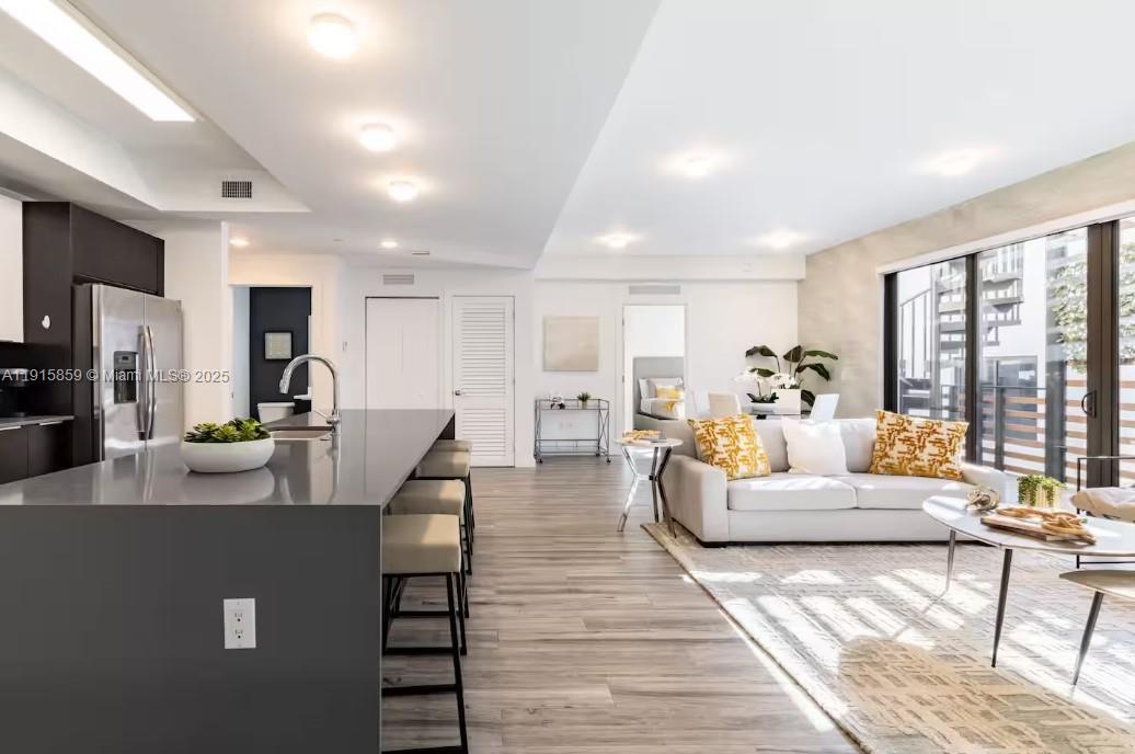 2955 Bird Avenue, Unit PHB Miami, FL 33133 - Photo 2 of 23 a living room with furniture and a large window