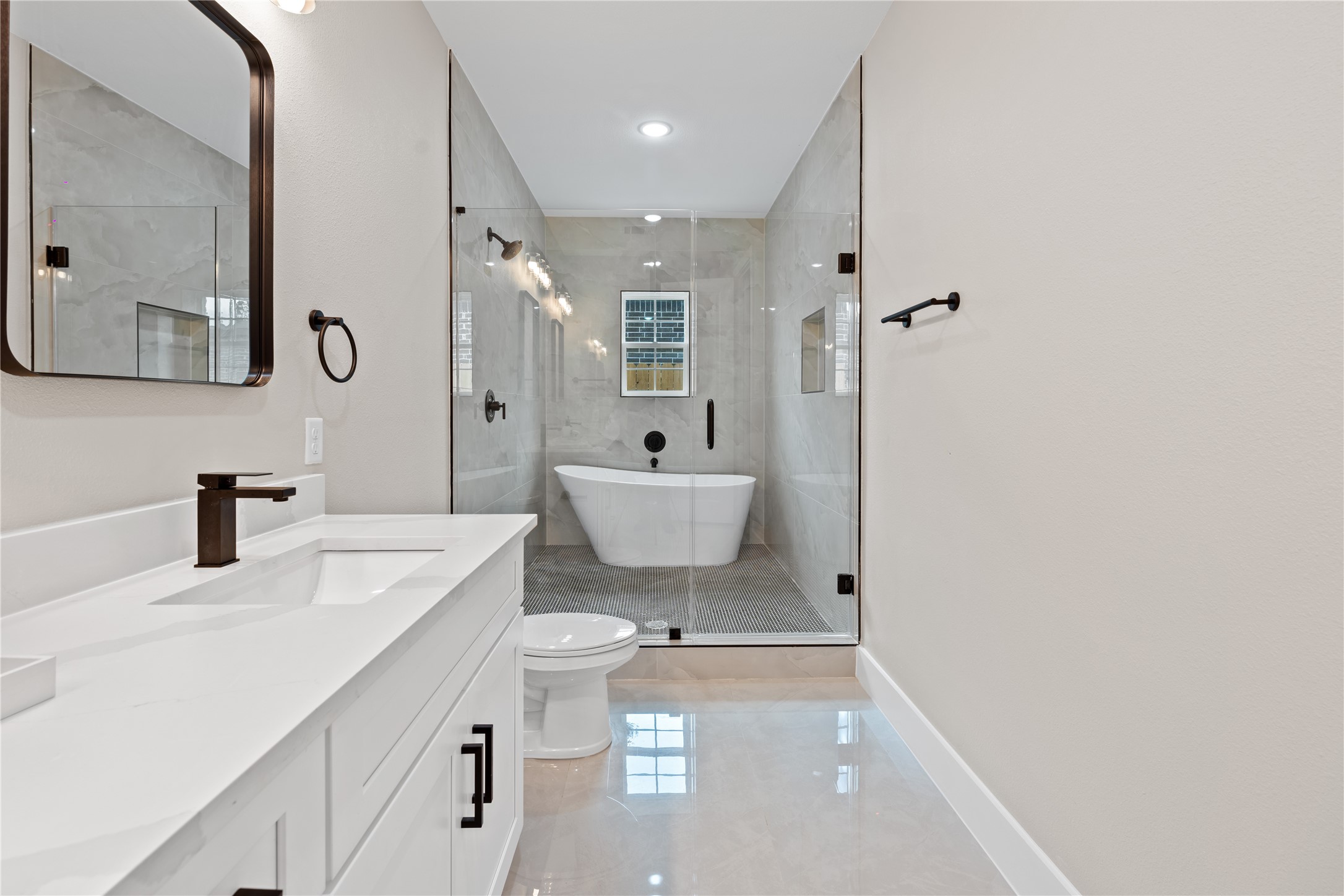 2606 Piemonte Avenue Cir Spring Spring, TX 77388 - Photo 13 of 17 a bathroom with a sink a toilet and a mirror