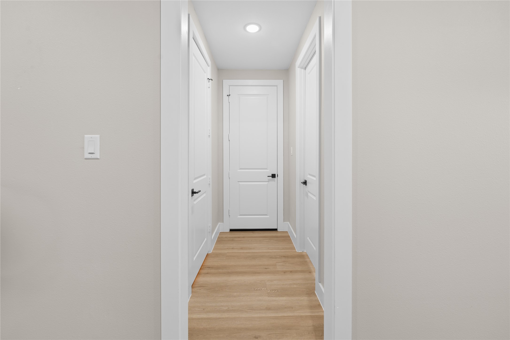 2606 Piemonte Avenue Cir Spring Spring, TX 77388 - Photo 15 of 17 a view of a hallway with wooden floor and a bathroom