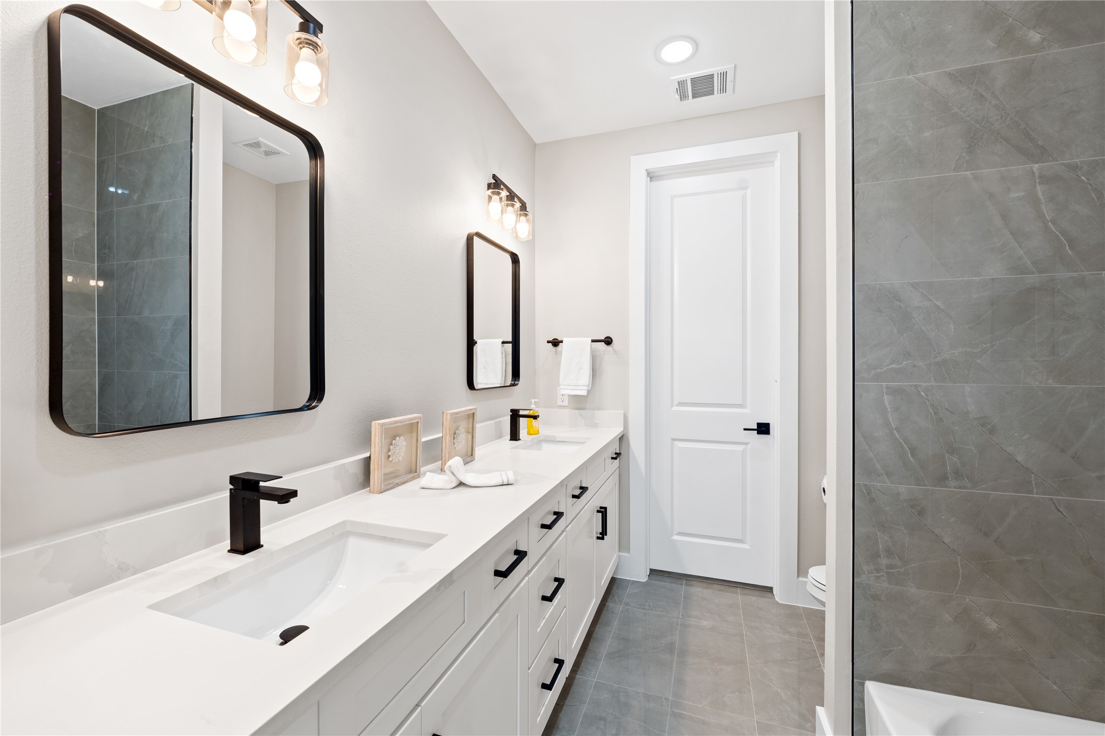 2606 Piemonte Avenue Cir Spring Spring, TX 77388 - Photo 16 of 17 a bathroom with a double vanity sink mirror and