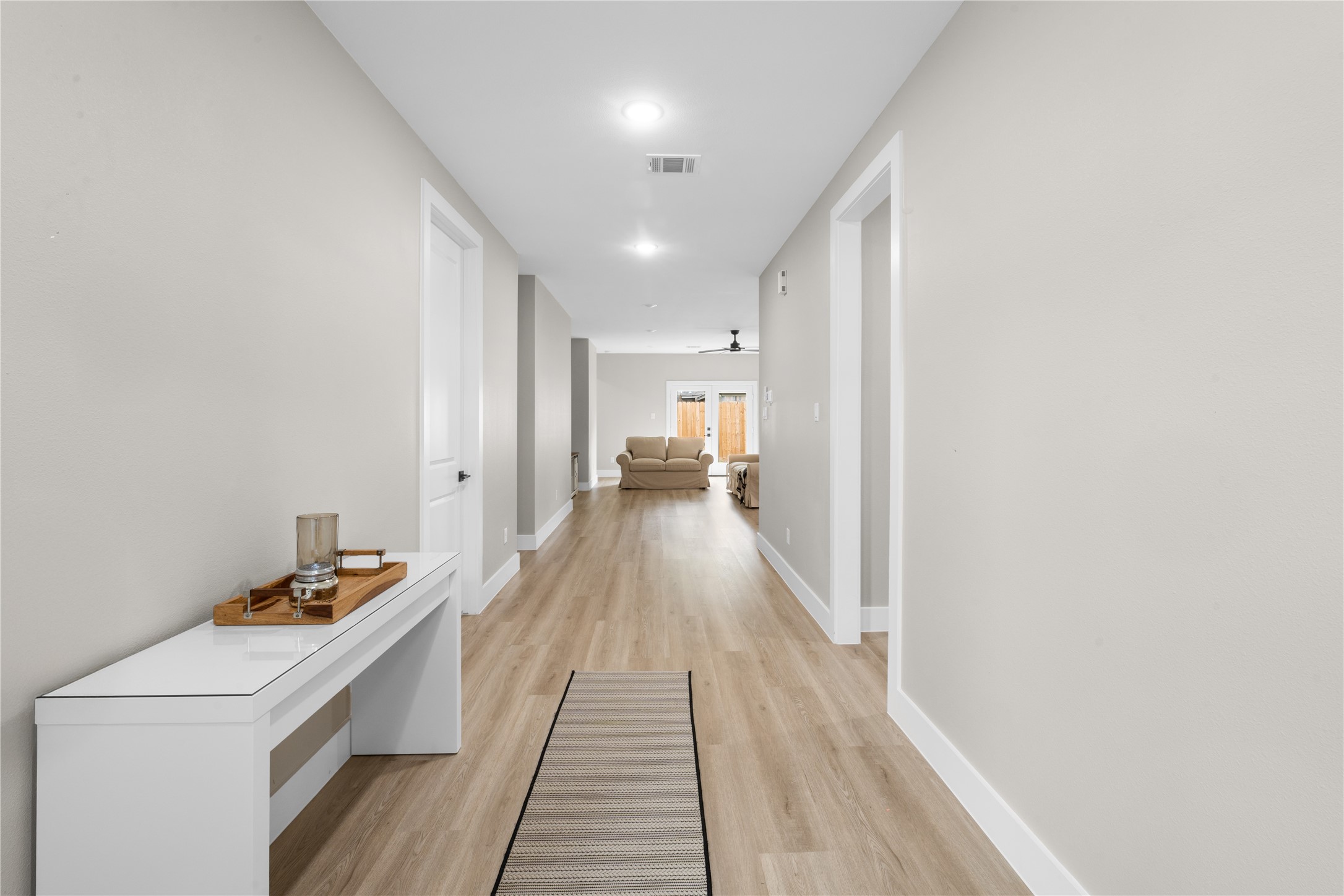 2606 Piemonte Avenue Cir Spring Spring, TX 77388 - Photo 2 of 17 a view of a hallway with wooden floor and furniture