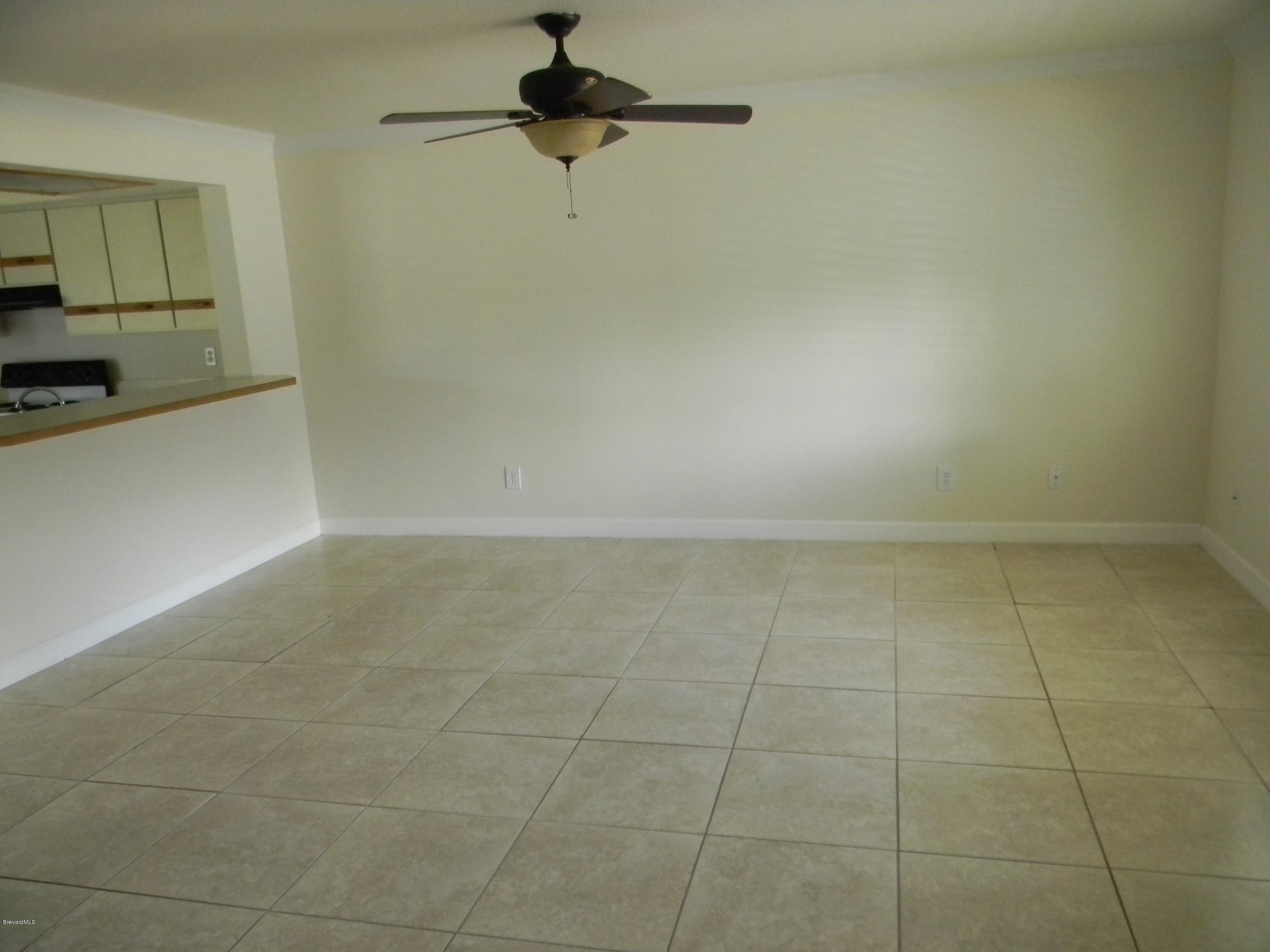 1880 Murrell Road, Unit 22 Rockledge, FL 32955 - Photo 3 of 19 Family room with breakfast bar