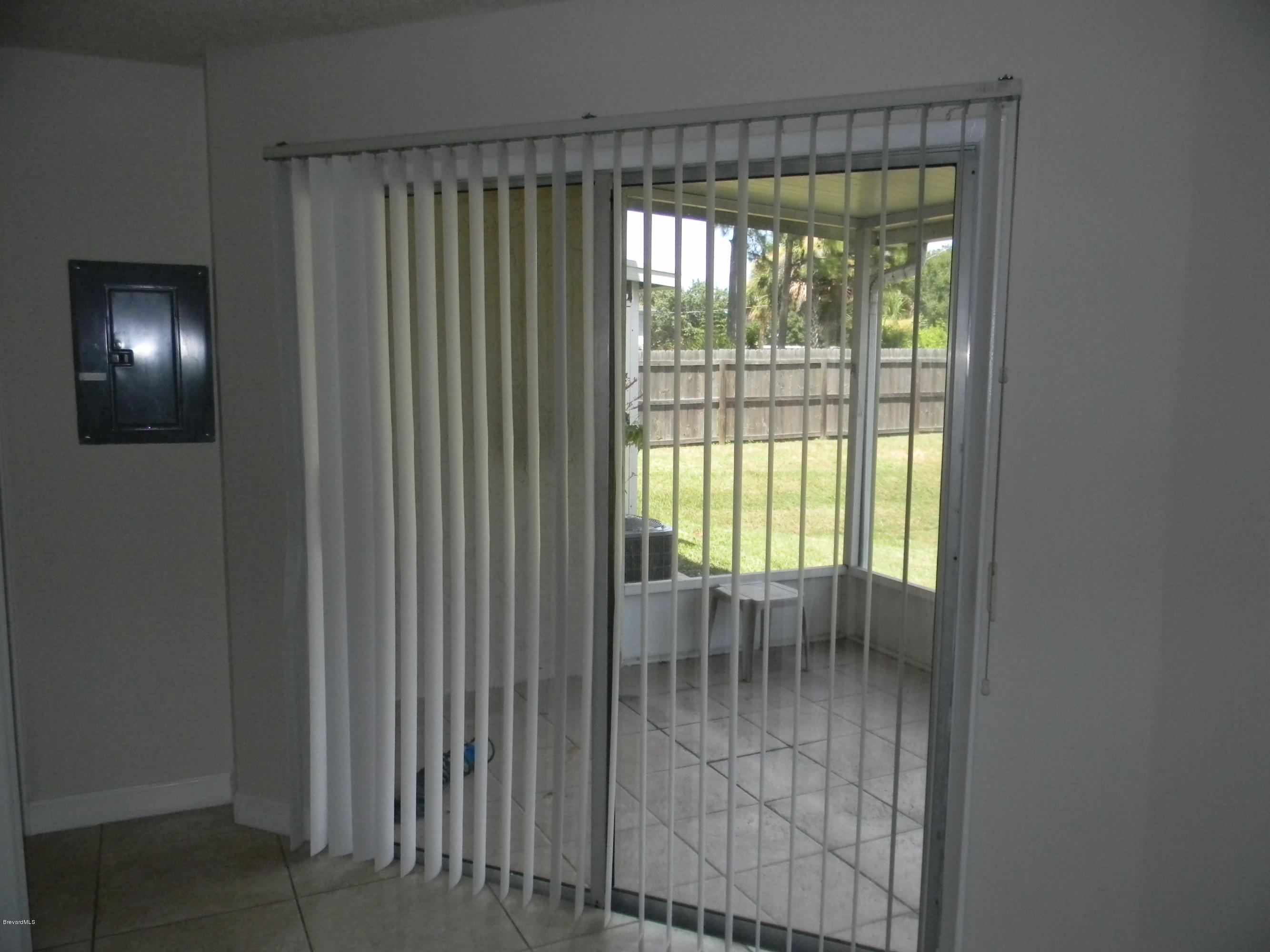 1880 Murrell Road, Unit 22 Rockledge, FL 32955 - Photo 7 of 19 Sliders from kitchen to screened porch
