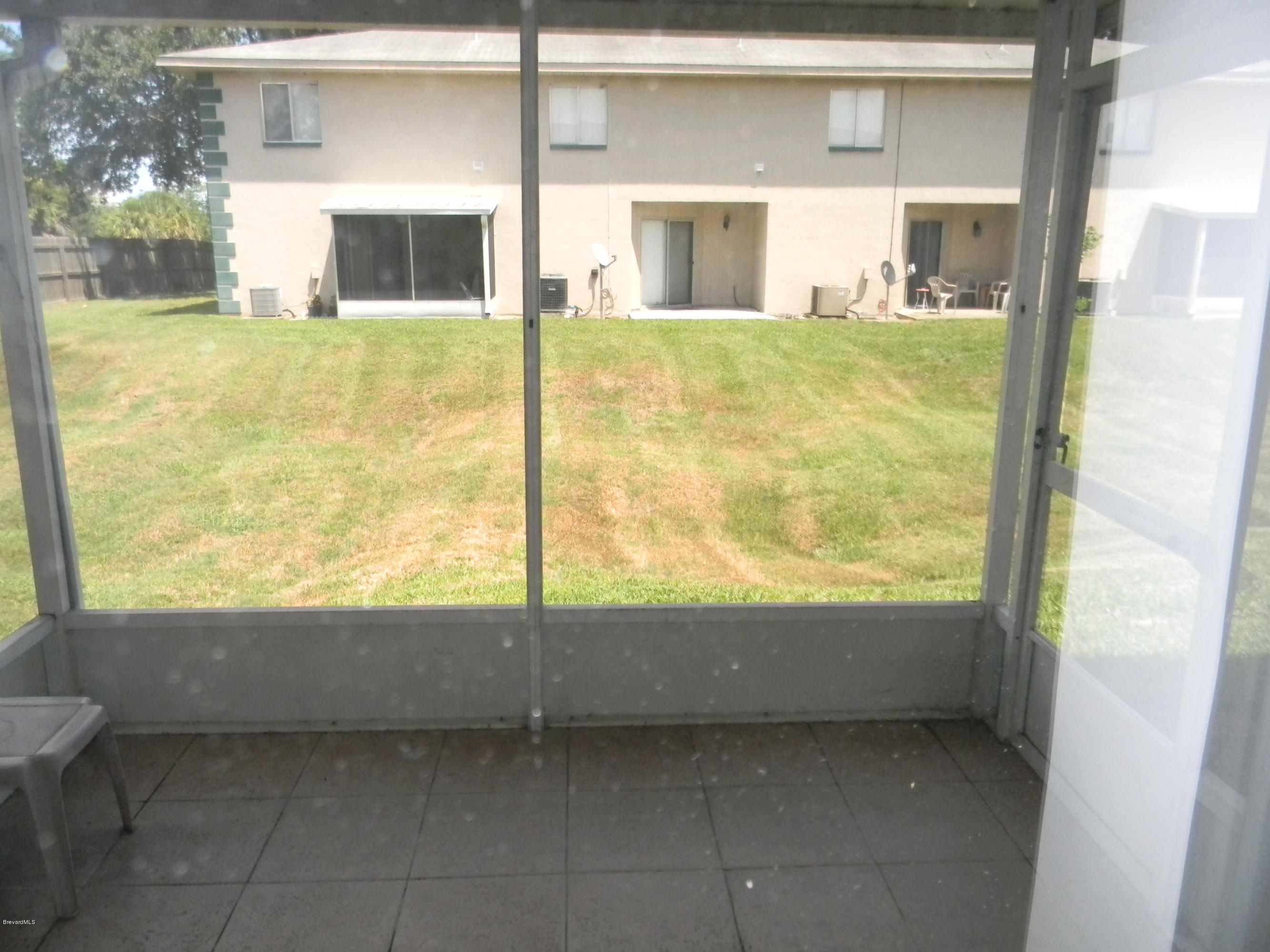 1880 Murrell Road, Unit 22 Rockledge, FL 32955 - Photo 8 of 19 Screened porch with tile