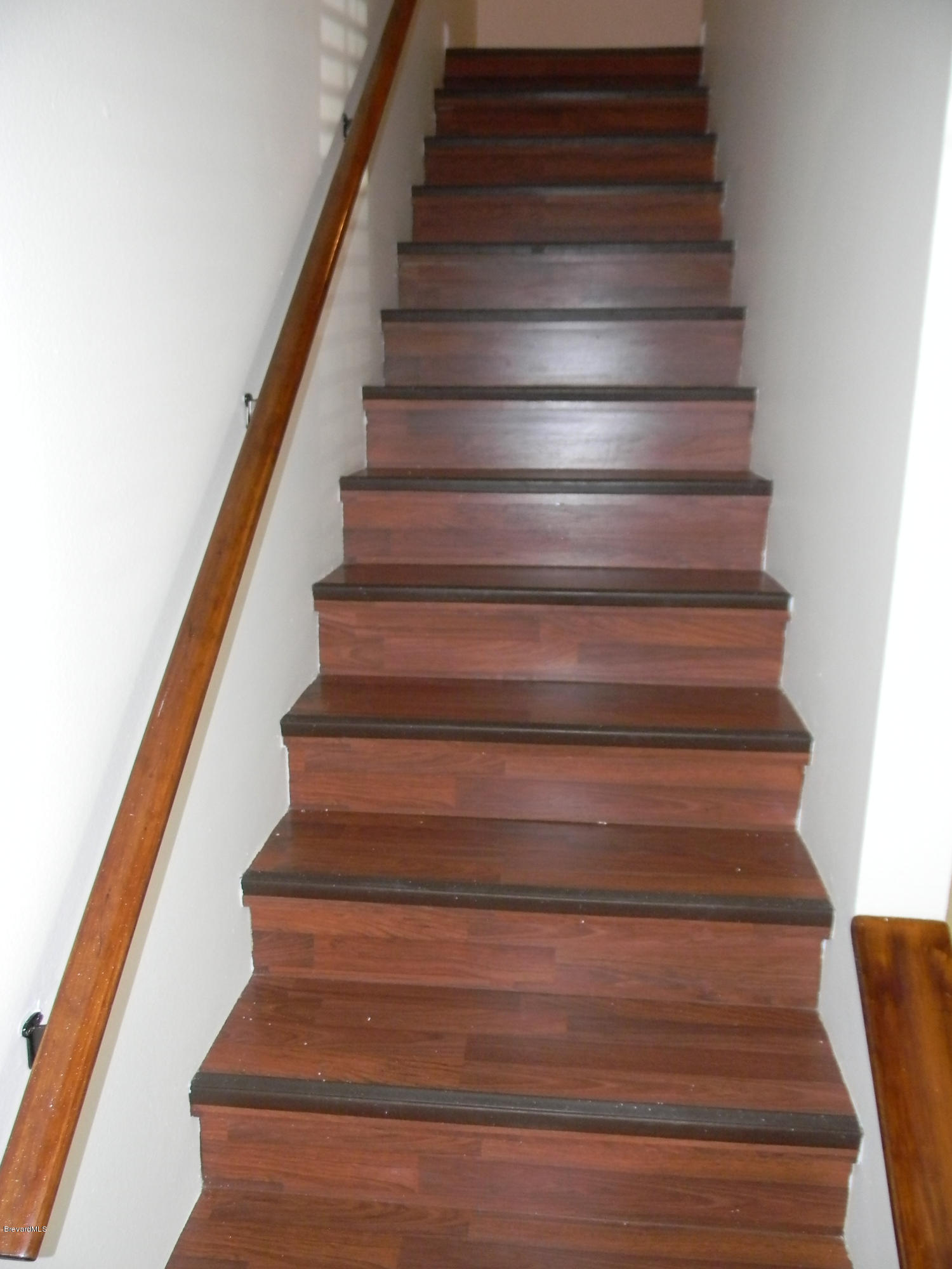 1880 Murrell Road, Unit 22 Rockledge, FL 32955 - Photo 10 of 19 Wood laminate stairs