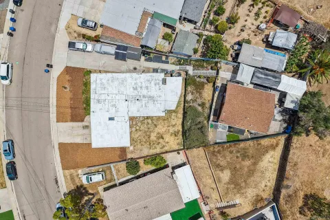 an aerial view of residential houses with outdoor space