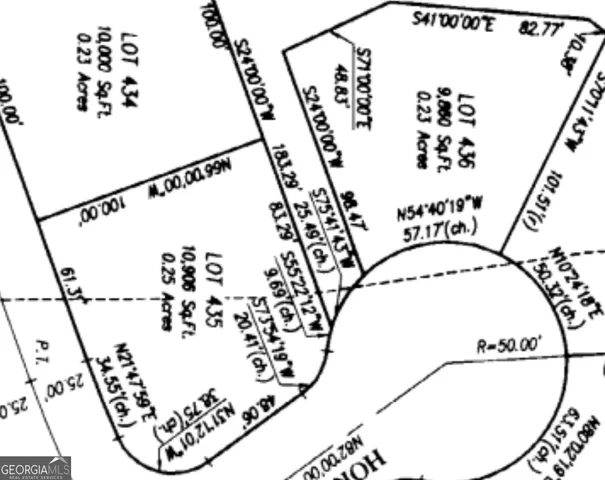 a view of a room with rack on the wall and a potted plant