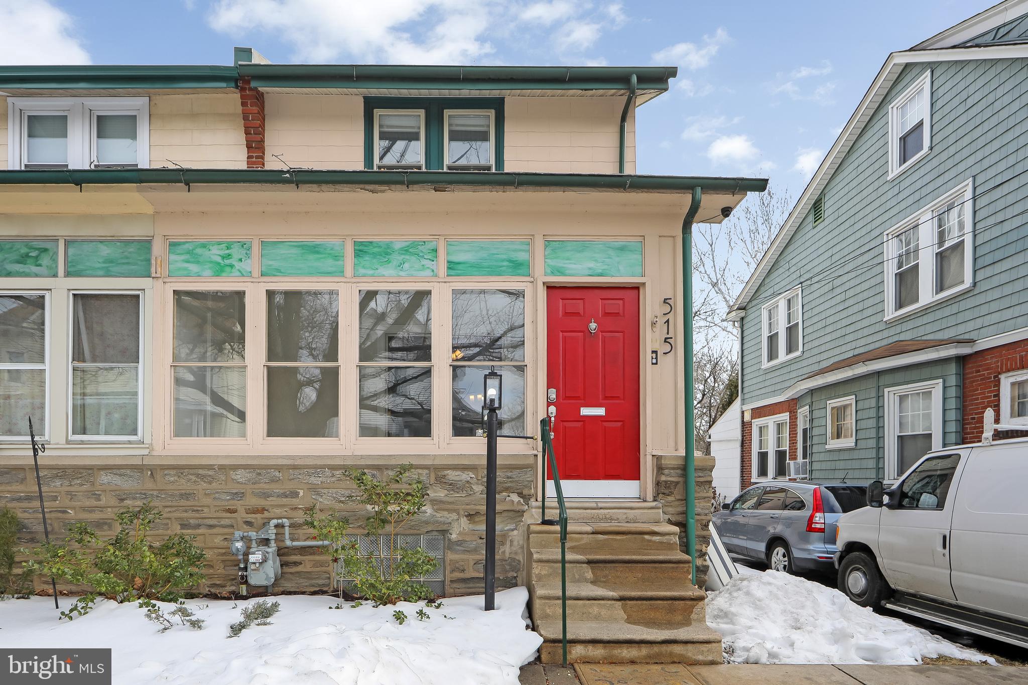 515 Ryers Avenue Cheltenham, PA 19012 - Photo 2 of 33 a front view of a residential apartment building with a yard