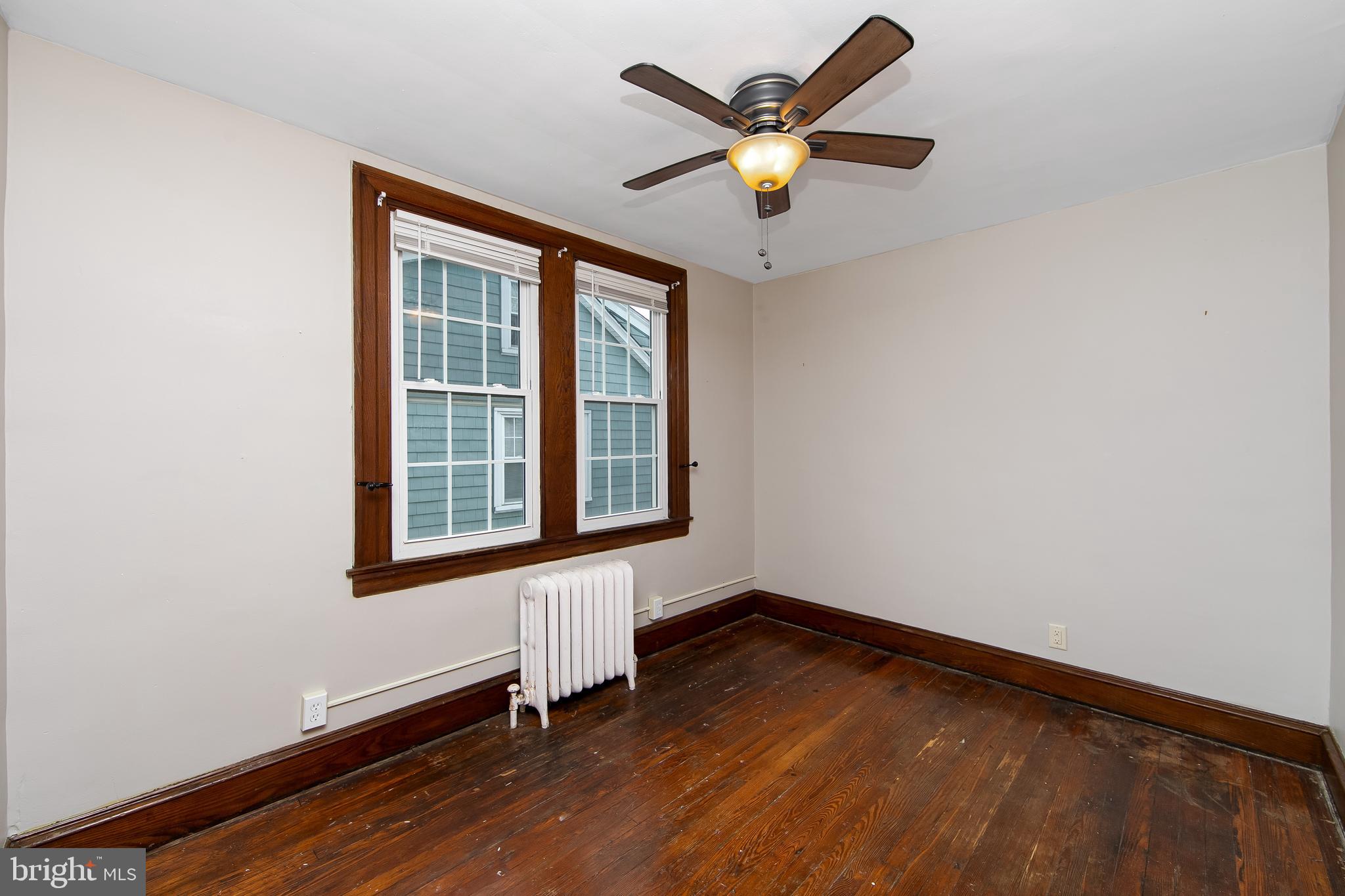 515 Ryers Avenue Cheltenham, PA 19012 - Photo 22 of 33 an empty room with a window and a ceiling fan