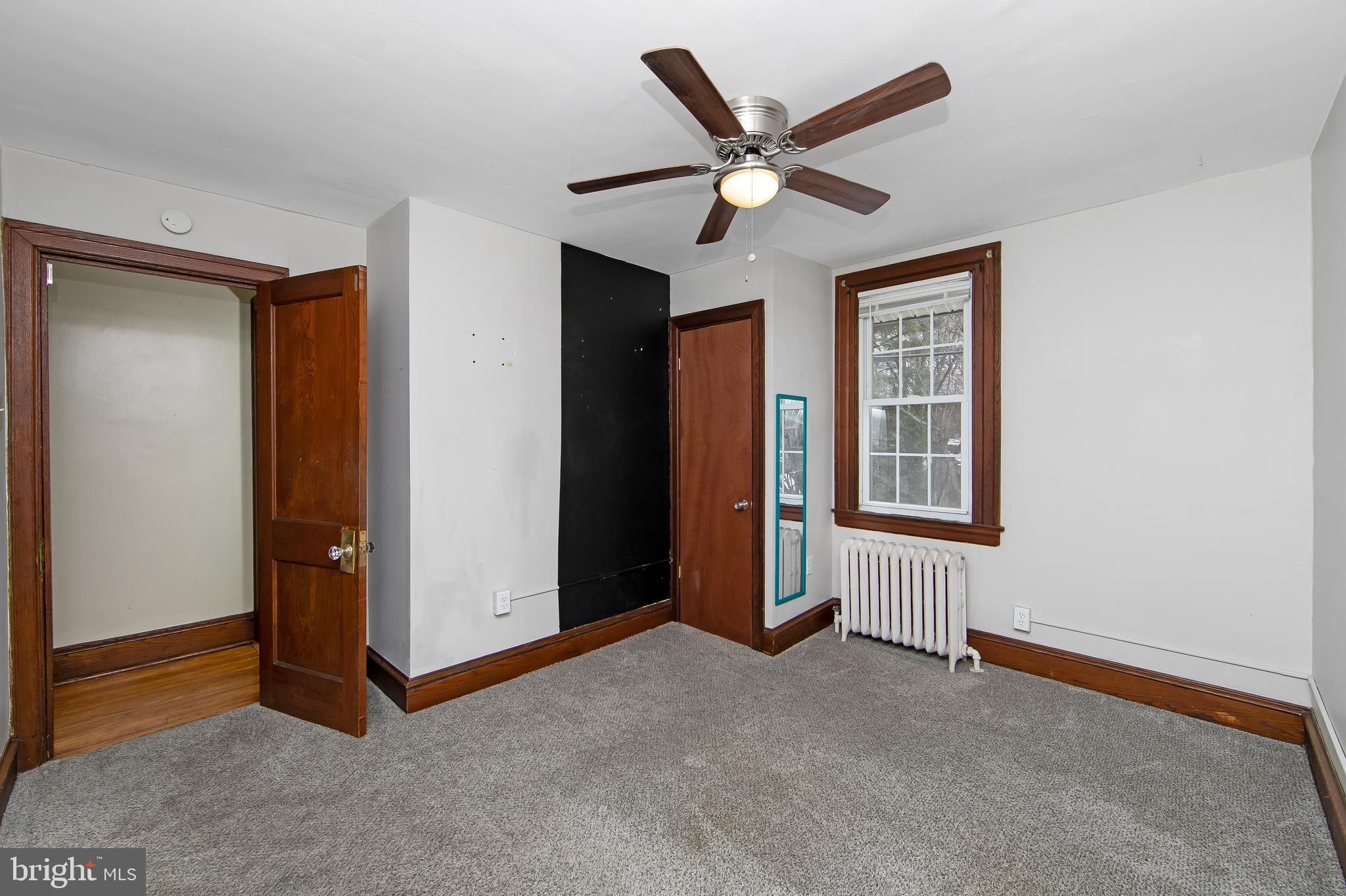 515 Ryers Avenue Cheltenham, PA 19012 - Photo 25 of 33 an empty room with closet and windows