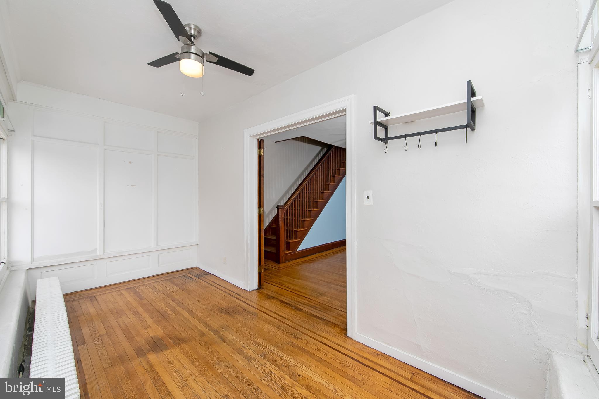 515 Ryers Avenue Cheltenham, PA 19012 - Photo 3 of 33 a view of a hallway with wooden floor and staircase