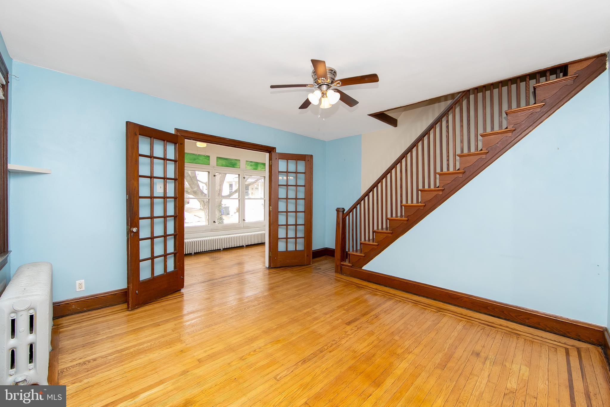 515 Ryers Avenue Cheltenham, PA 19012 - Photo 8 of 33 a view of empty room with wooden floor and fan