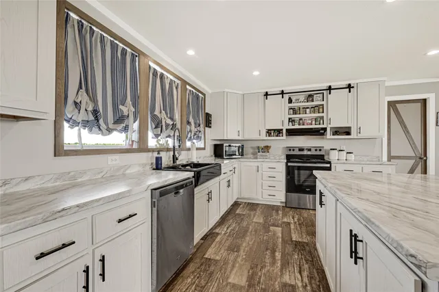 a kitchen with sink and cabinets