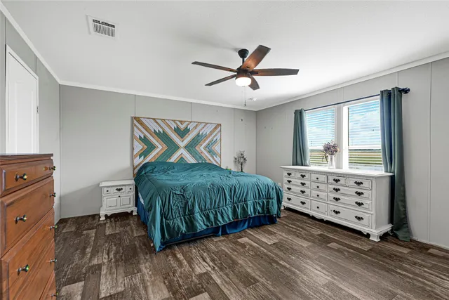 a bedroom with a bed and dresser