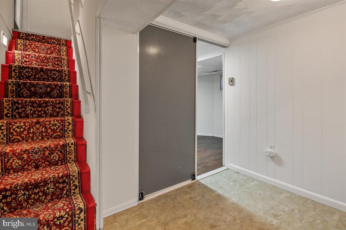 15929 Attleboro Road Silver Spring, MD 20905 - Photo 29 of 46 Basement steps with lighting