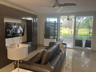 a kitchen with granite countertop white cabinets and a sink