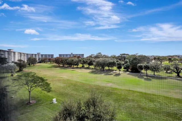 a view of a golf course with a lake