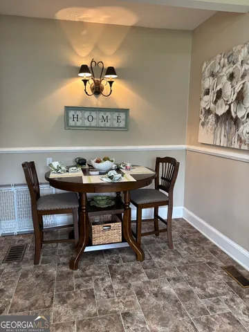 a view of a table and chairs in a room