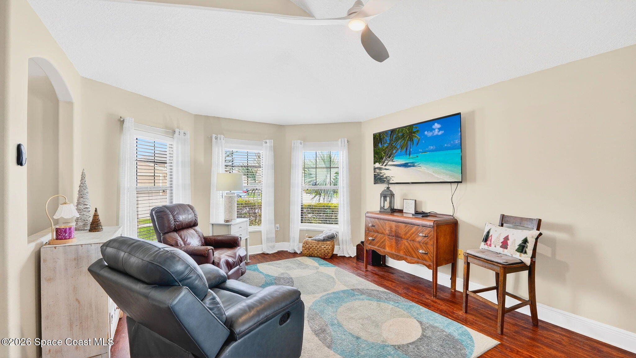 4082 Brantley Circle Rockledge, FL 32955 - Photo 15 of 53 a living room with furniture a flat screen tv and a window