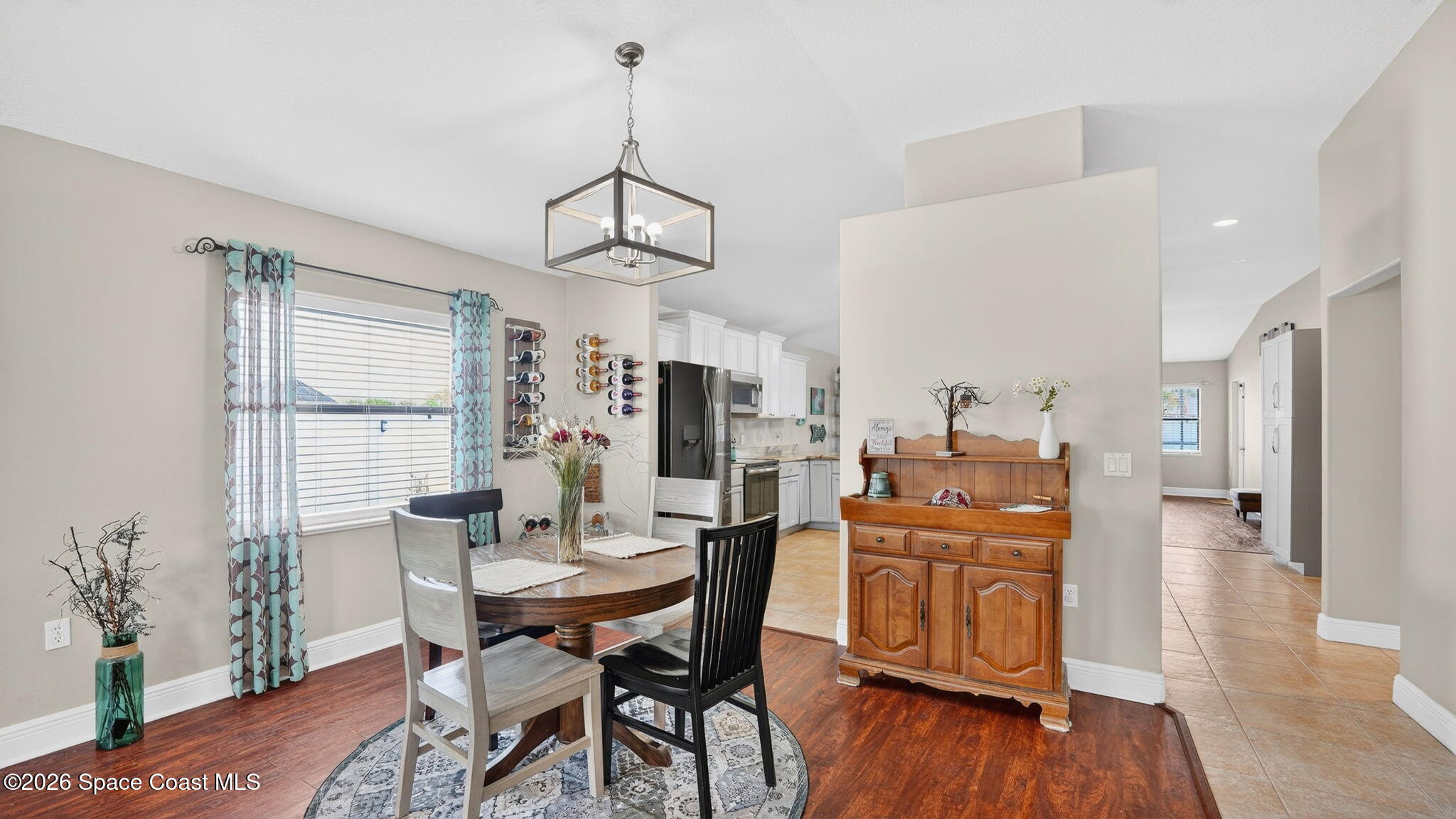 4082 Brantley Circle Rockledge, FL 32955 - Photo 16 of 53 a view of a dining room with furniture window and wooden floor