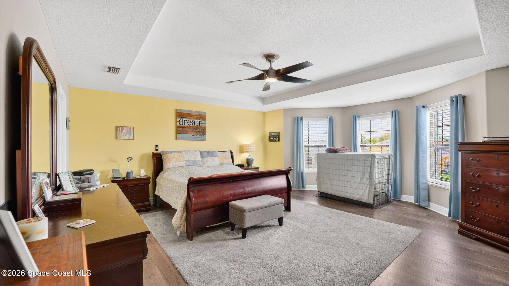 4082 Brantley Circle Rockledge, FL 32955 - Photo 22 of 53 a bed room with a bed and a chandelier