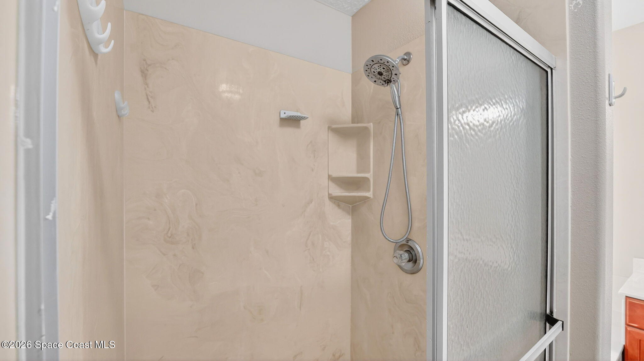 4082 Brantley Circle Rockledge, FL 32955 - Photo 26 of 53 a bathroom with a glass shower door