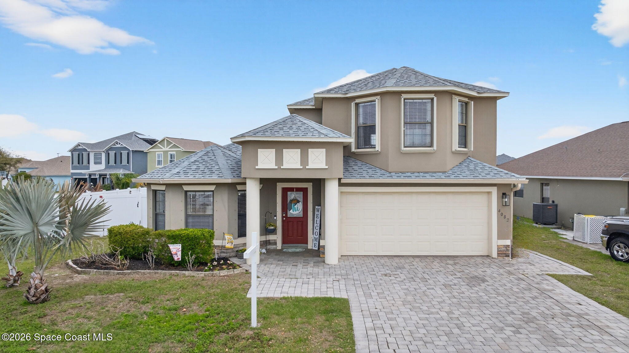 4082 Brantley Circle Rockledge, FL 32955 - Photo 38 of 53 a front view of a house with a yard and garage