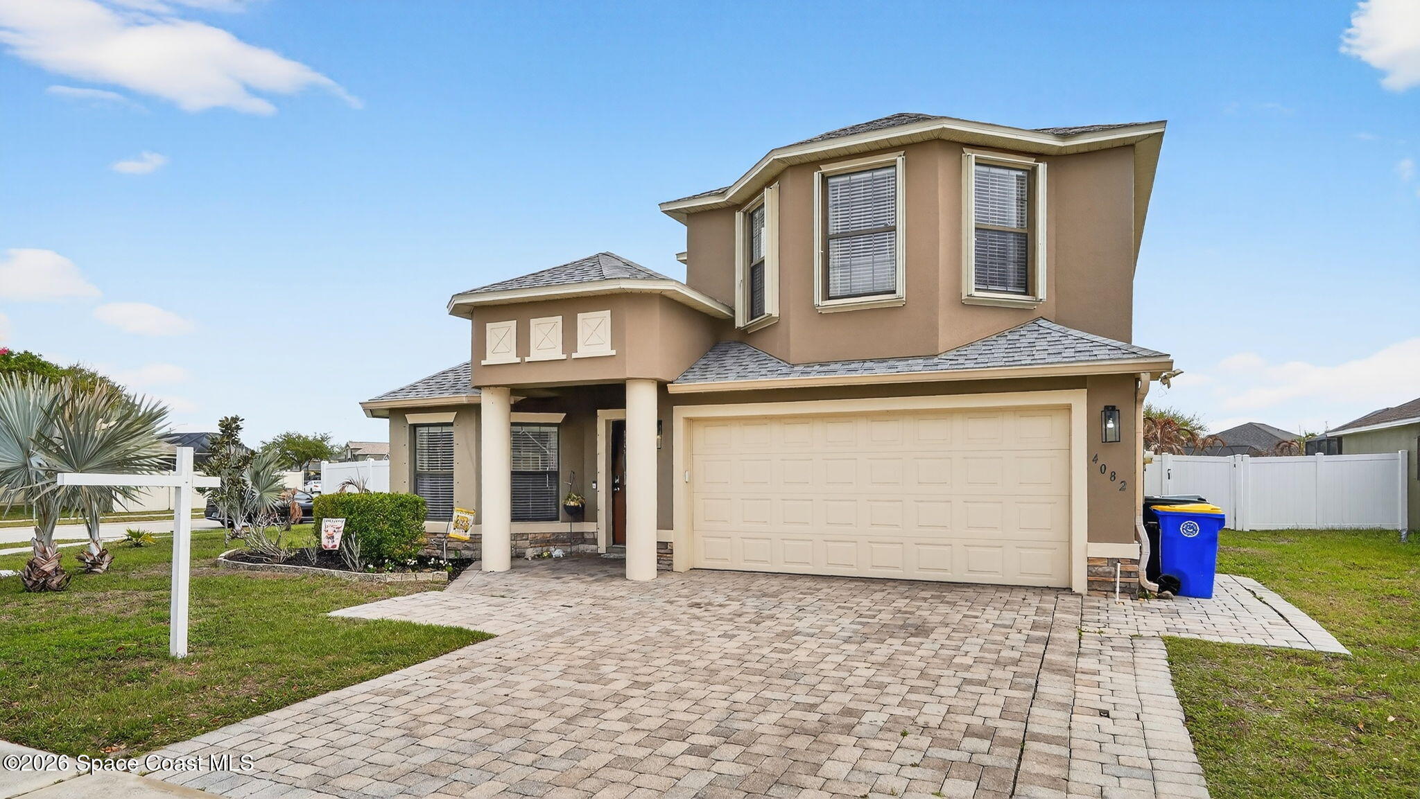 4082 Brantley Circle Rockledge, FL 32955 - Photo 40 of 53 a front view of a house with a yard and garage