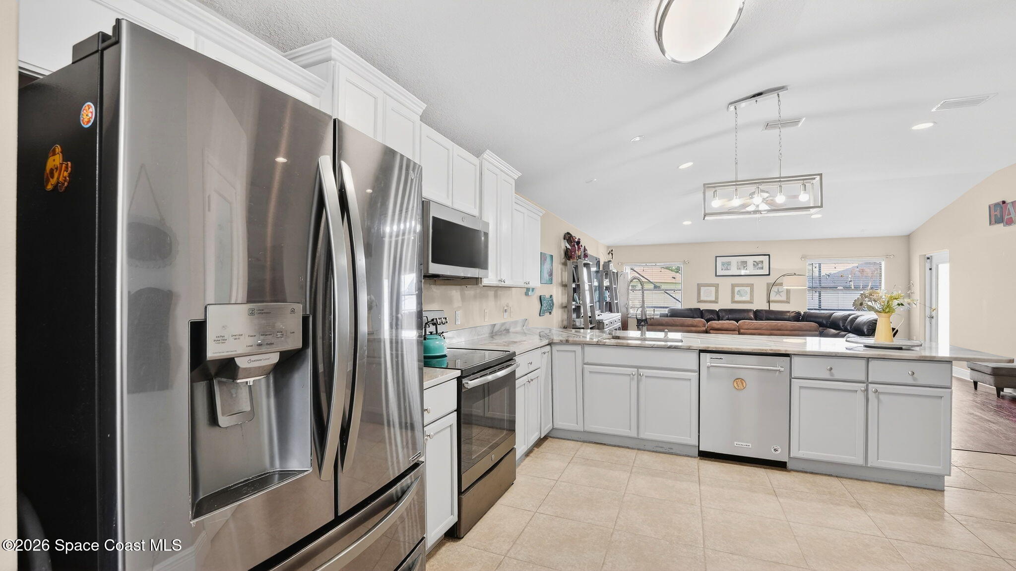 4082 Brantley Circle Rockledge, FL 32955 - Photo 8 of 53 a kitchen with stainless steel appliances a sink stove and refrigerator