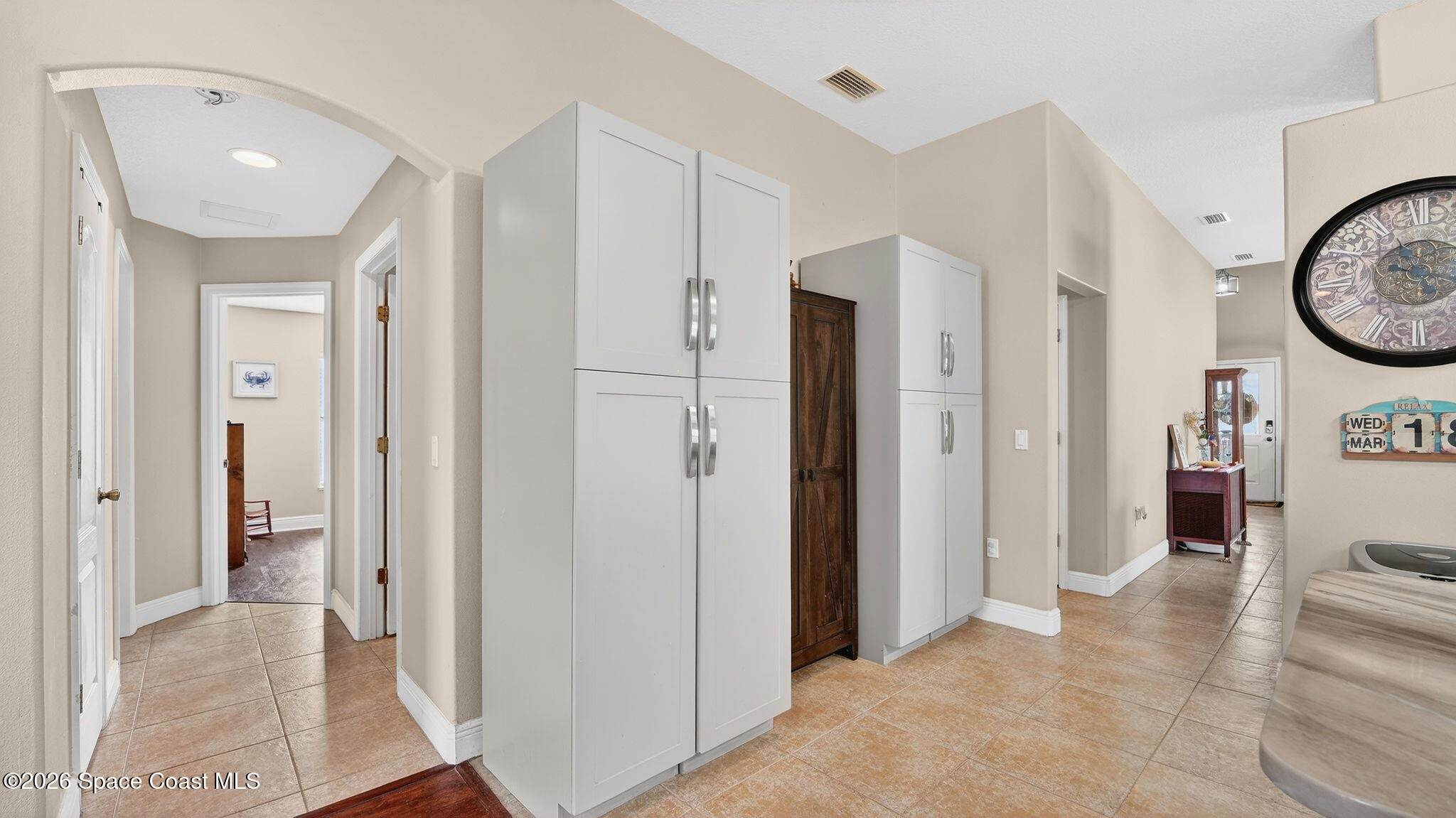 4082 Brantley Circle Rockledge, FL 32955 - Photo 10 of 53 a view of a hallway with bathroom and wooden floor