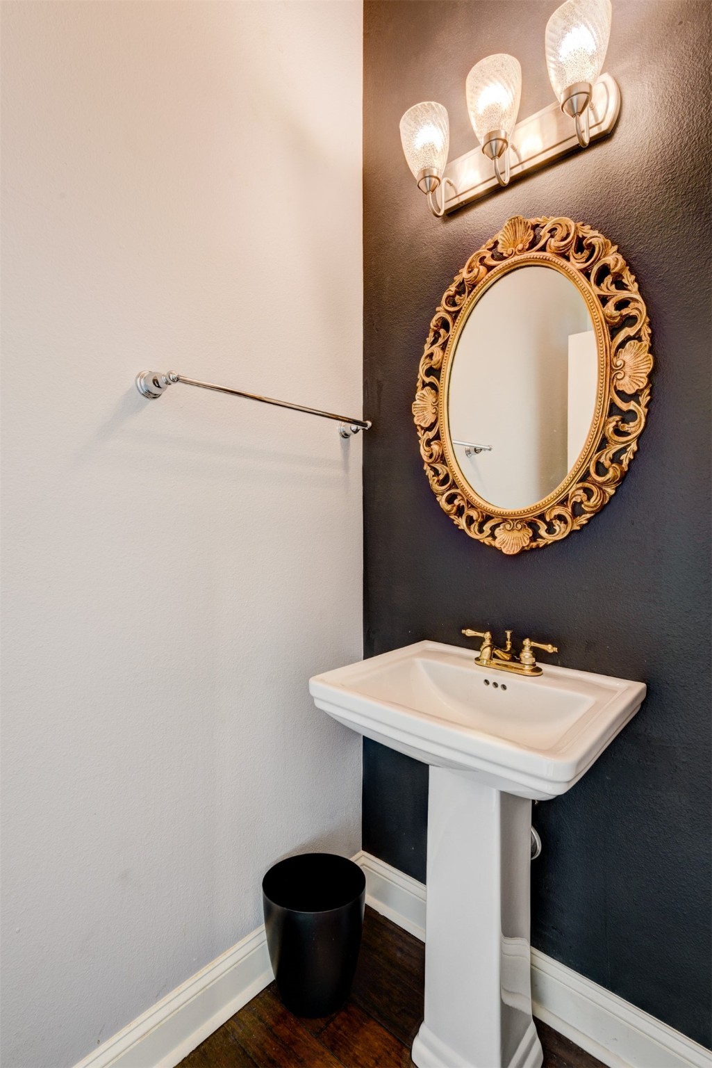 1124 West Dallas Street Houston, TX 77019 - Photo 13 of 28 a bathroom with a sink and a mirror