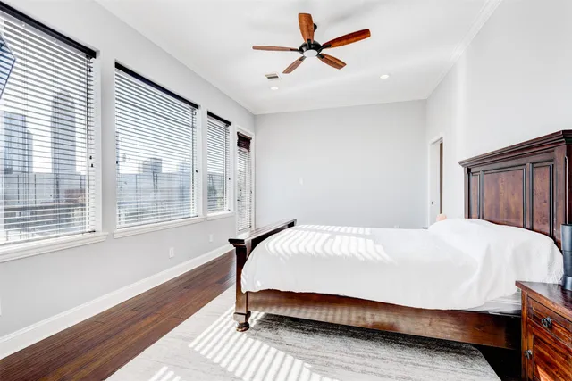 a bed sitting in a bedroom next to a window