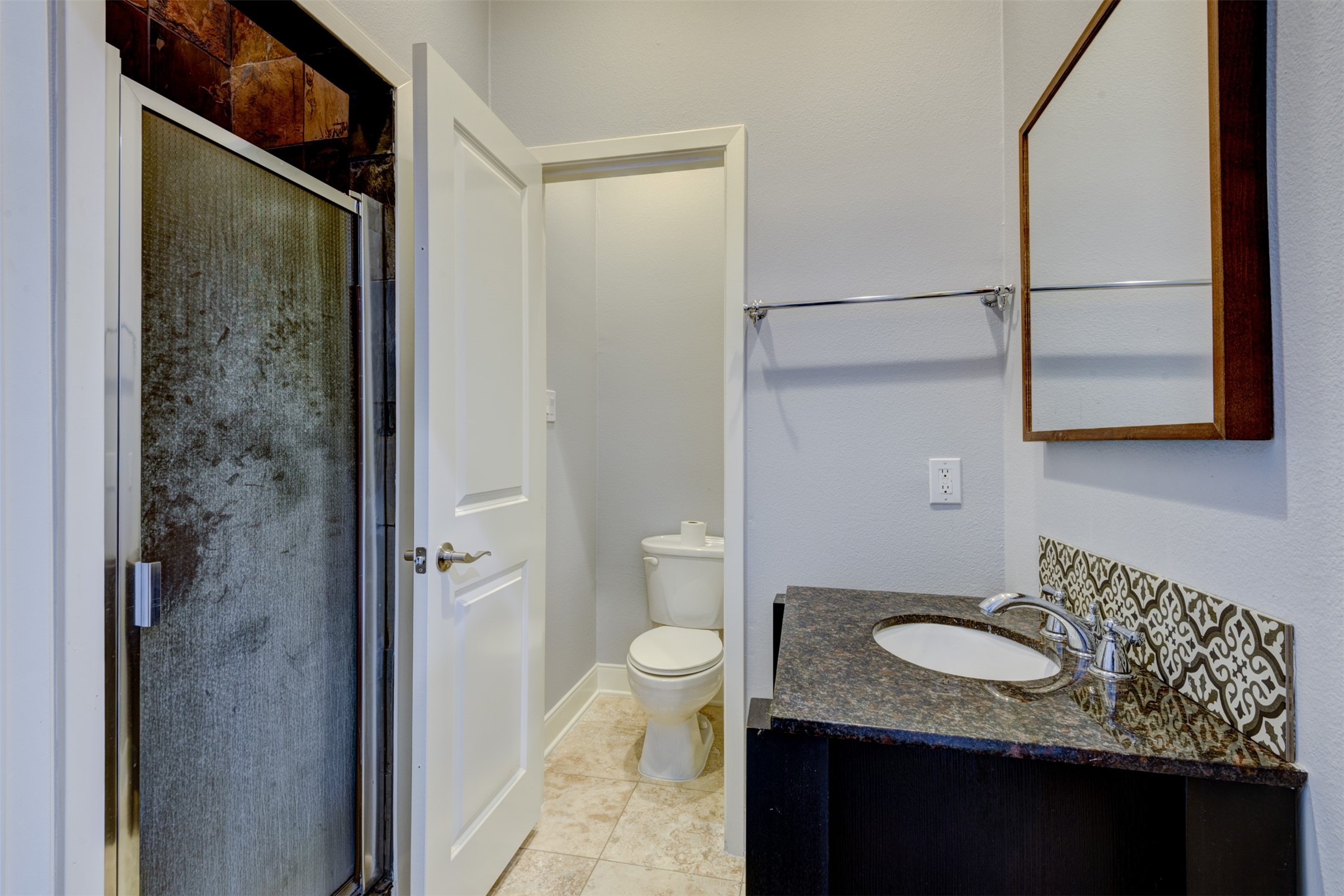 1124 West Dallas Street Houston, TX 77019 - Photo 19 of 28 a bathroom with a granite countertop sink and a toilet