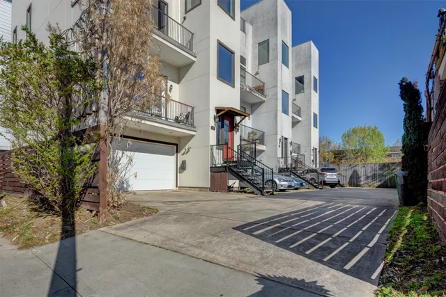 a view of a brick building with many windows