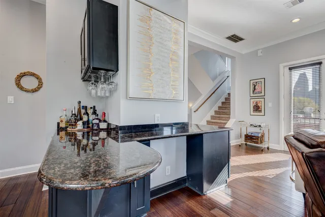 a dining table with chairs and wooden floor