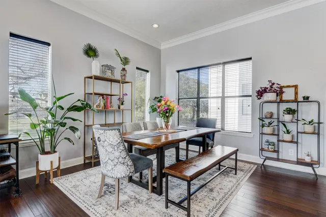 a view of a work space with furniture and wooden floor