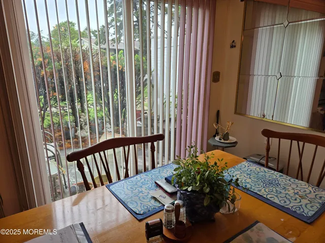 a view of a balcony with furniture
