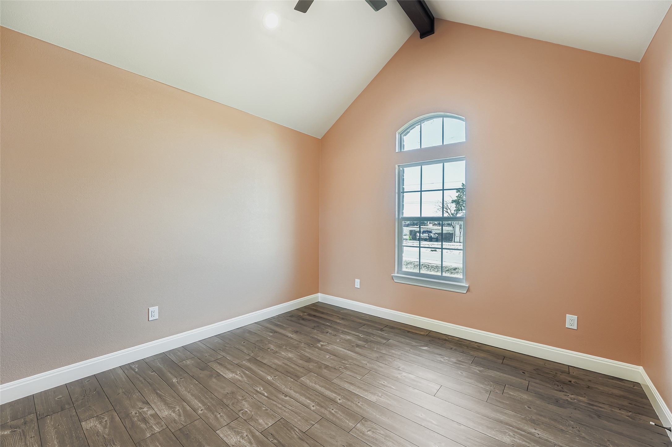 222 Arosa Drive Elgin, TX 78621 - Photo 27 of 40 an empty room with wooden floor and windows