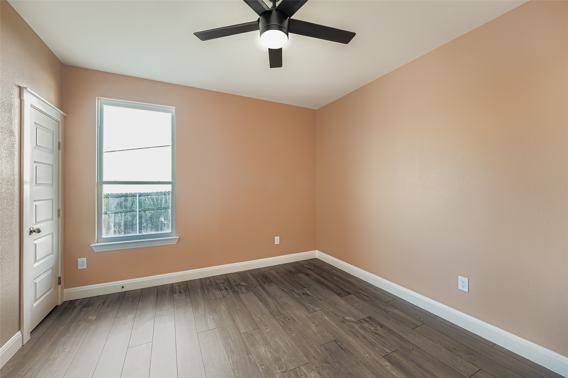 222 Arosa Drive Elgin, TX 78621 - Photo 29 of 40 wooden floor in an empty room with a window