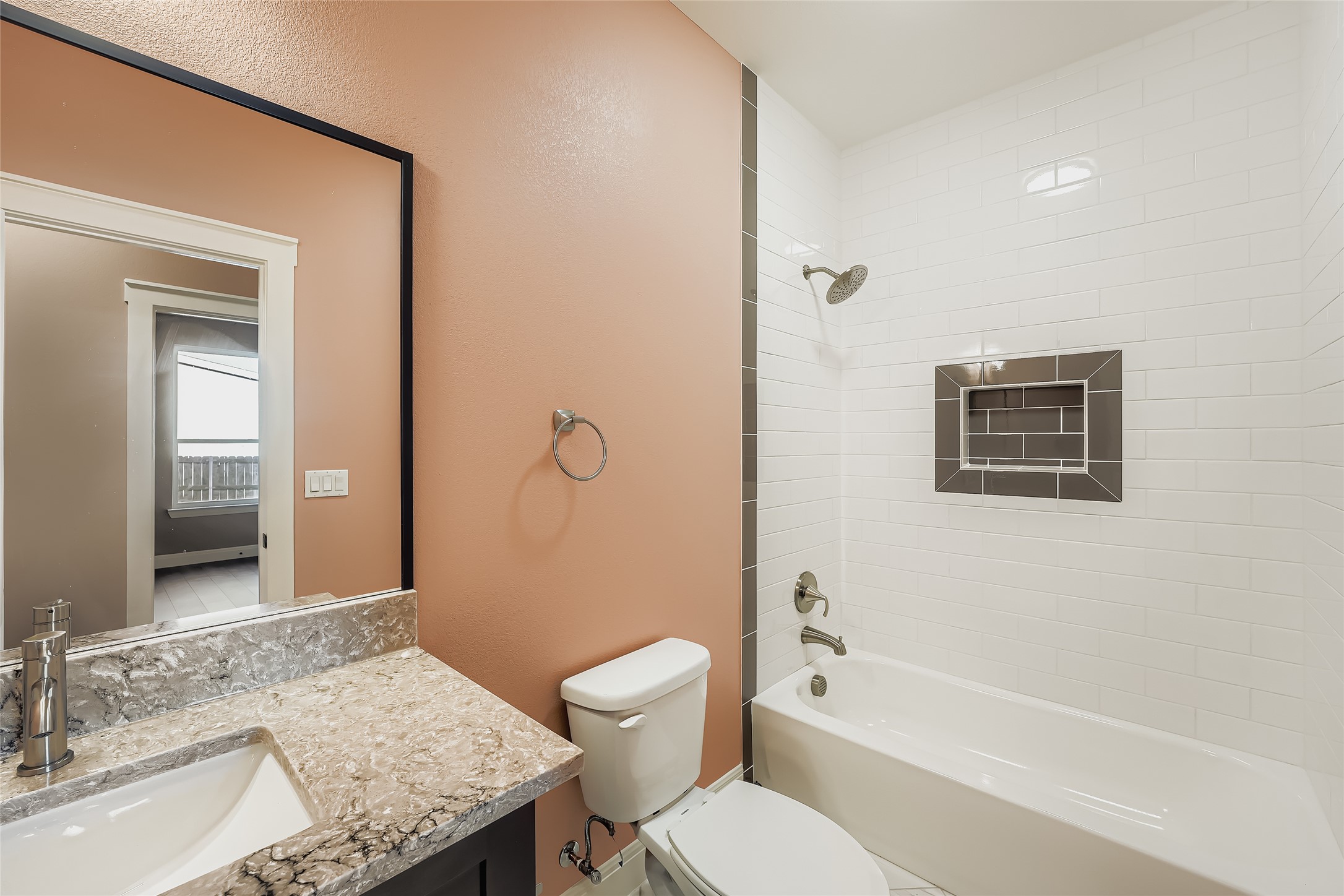 222 Arosa Drive Elgin, TX 78621 - Photo 32 of 40 a bathroom with a granite countertop sink a toilet and shower