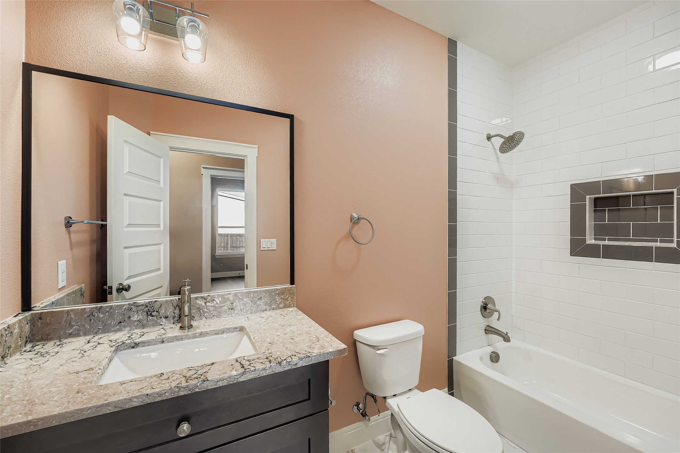222 Arosa Drive Elgin, TX 78621 - Photo 34 of 40 a bathroom with a granite countertop sink toilet and shower